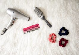 Grey Hair Blower Near Pink Hair Combs and Scrunchies