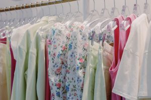 White Blue and Yellow Floral Dress Hanging on Clothing Rack